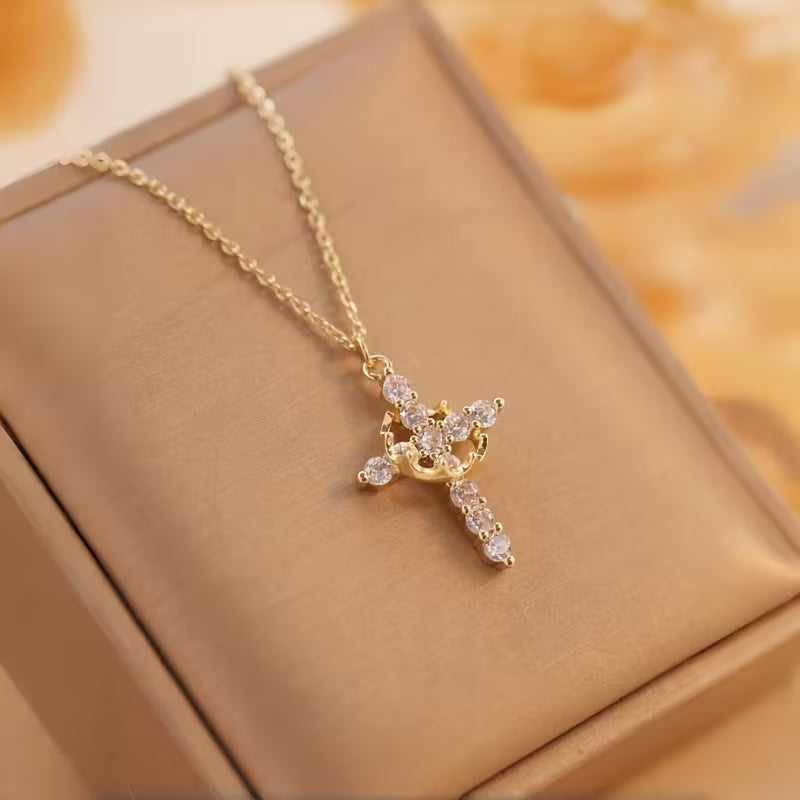 Collar cruz con corona giratoria👑