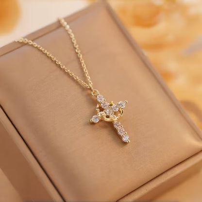 Collar cruz con corona giratoria👑